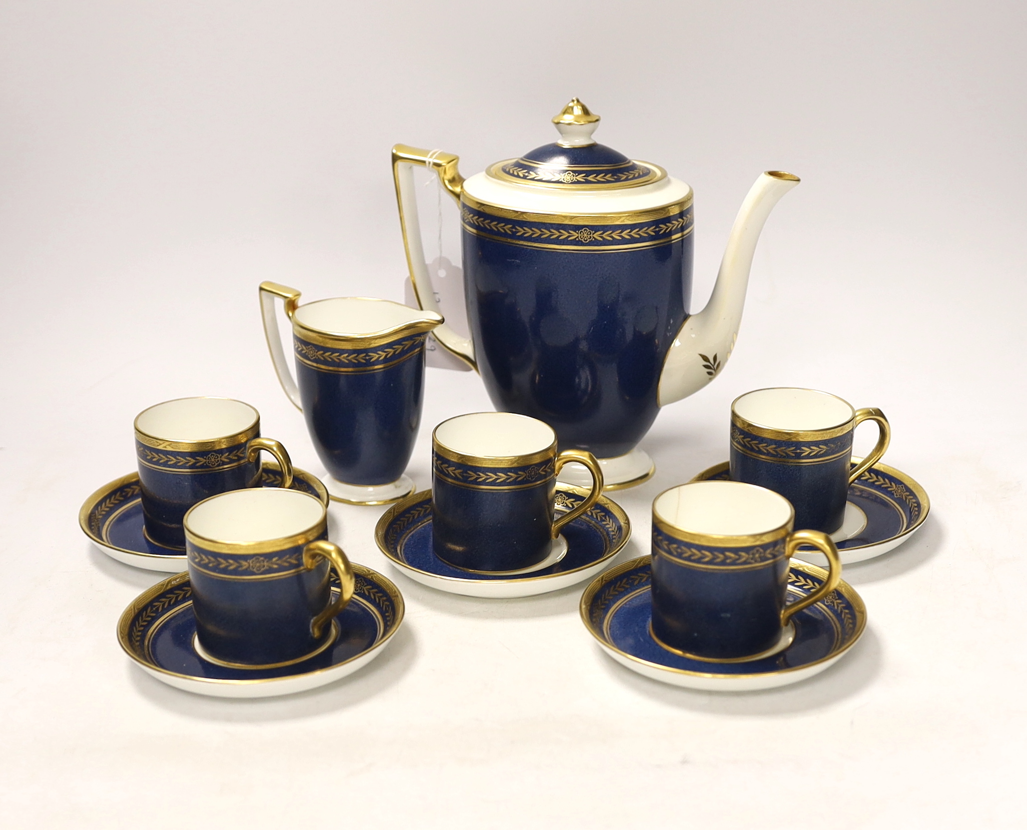 A Mintons powder blue part coffee set comprising six cans and saucers, coffee pot and milk jug together with a Staffordshire flat back figure group, 20cm wide